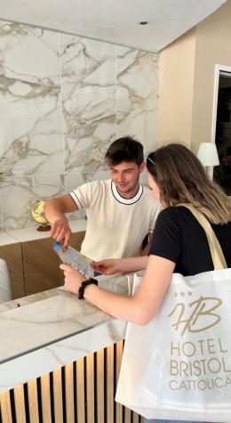 Two people check a map at the Hotel Bristol reception.